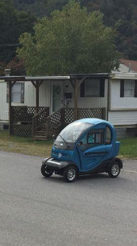 Double take!  A tiny electric car is a rare sight to see in Hinton.