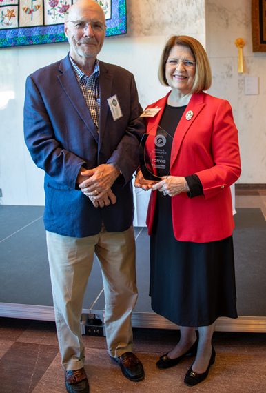 David Barnette, Chairman of CU's Board of Governors, with President Boggess