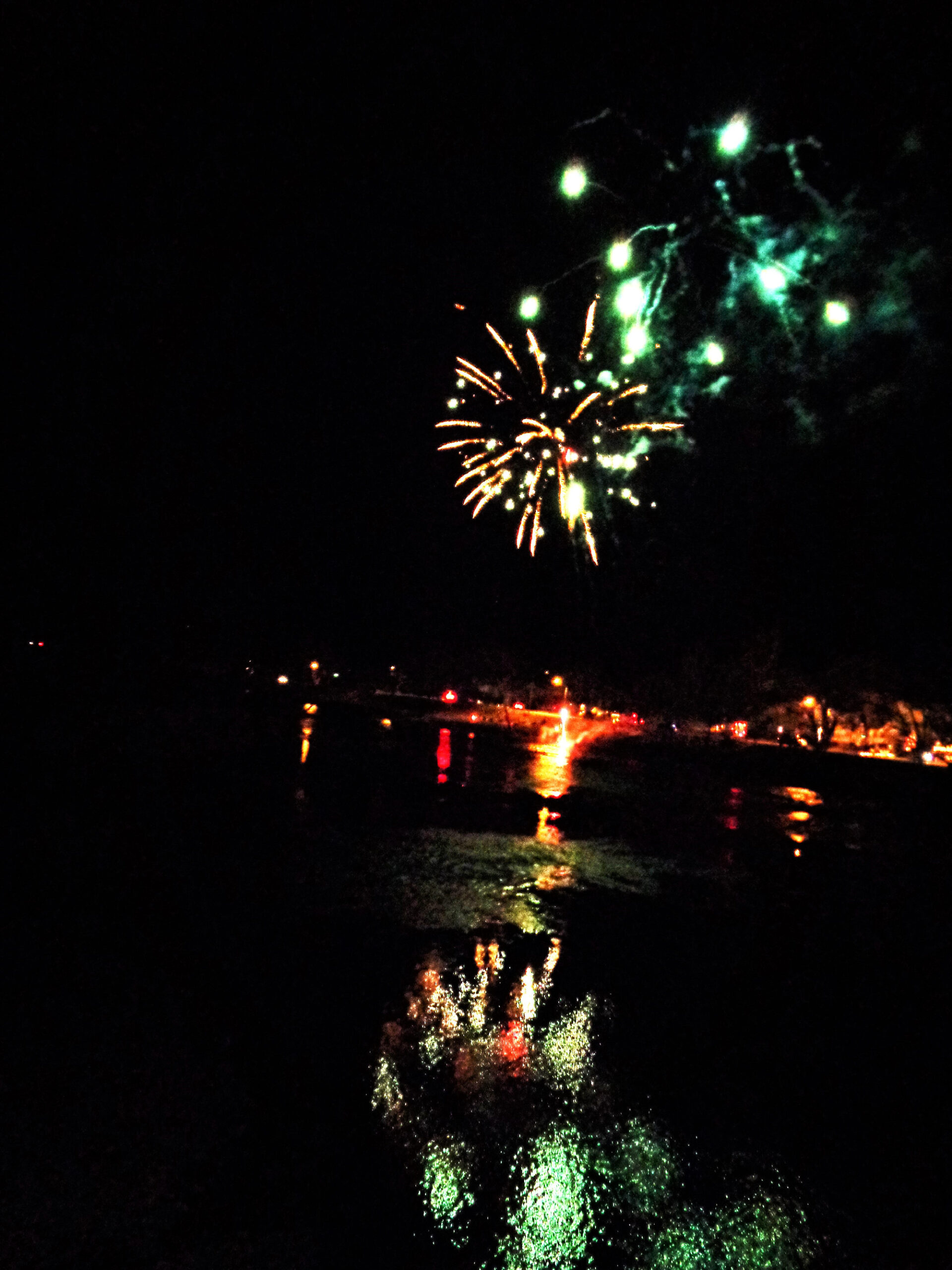 Fireworks in Alderson in a previous year with reflections in the Greenbrier River.