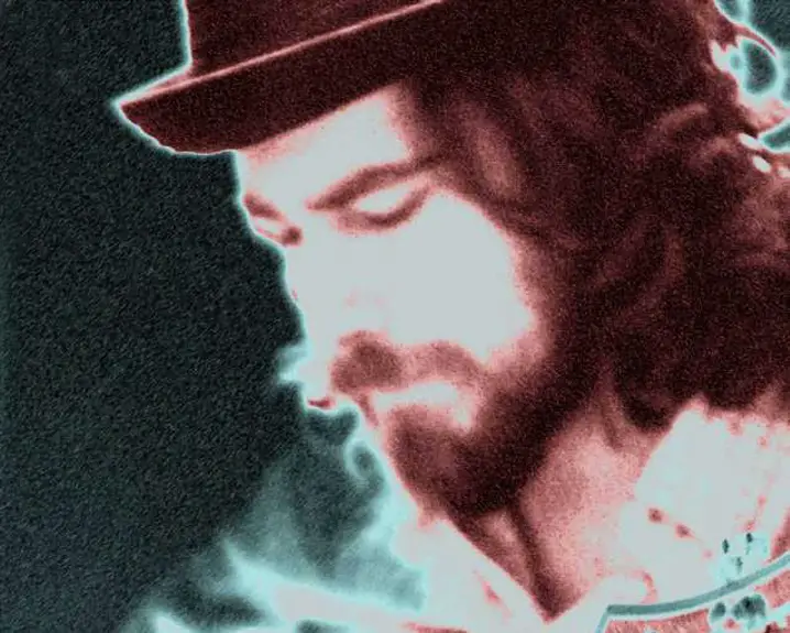 Guitarist and songwriter Ezra Newkirk. Photo in sepia by Cheryl Mansley