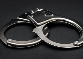 Handcuffs on a black background.