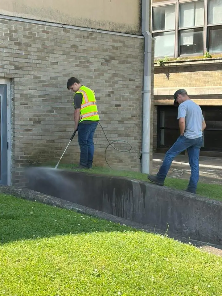 Maintenance workers pressure washing (Photo: Summers County Schools)