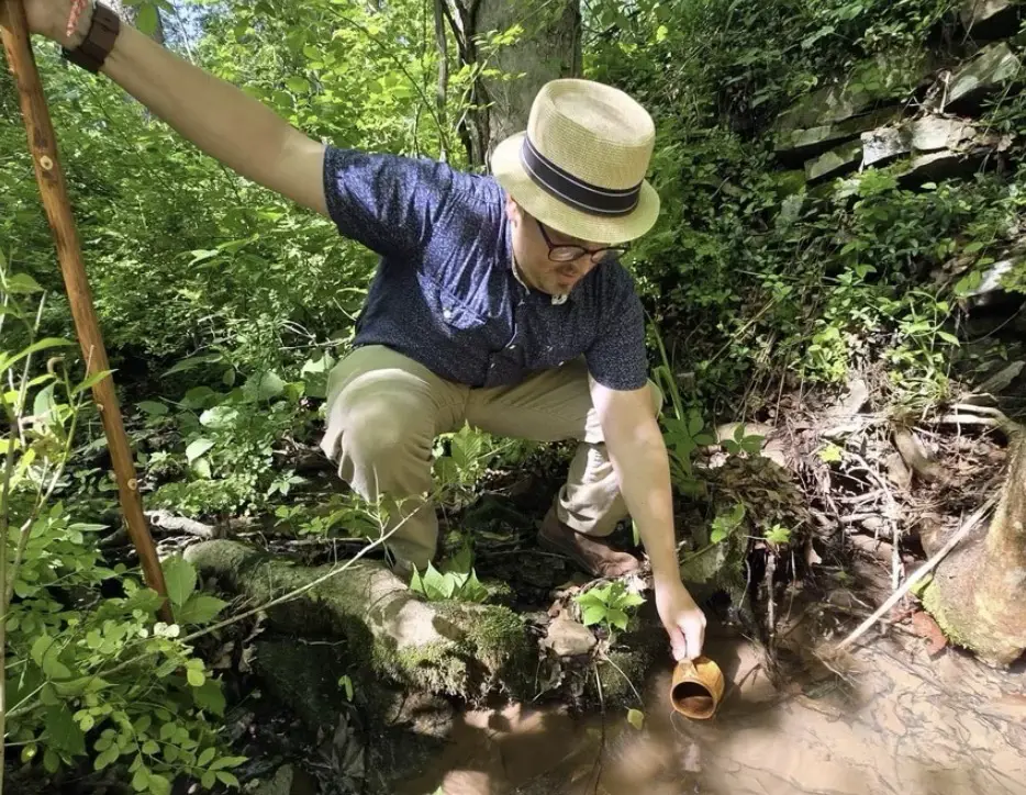 Me tasting the magnesia spring 