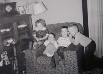 a black and white 1960's photo that shows the smoke stand to the right of the chair