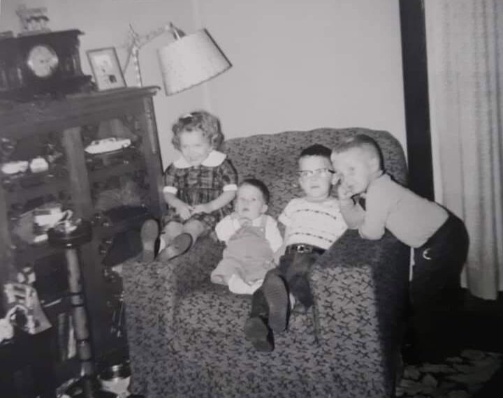 a black and white 1960's photo that shows the smoke stand to the right of the chair