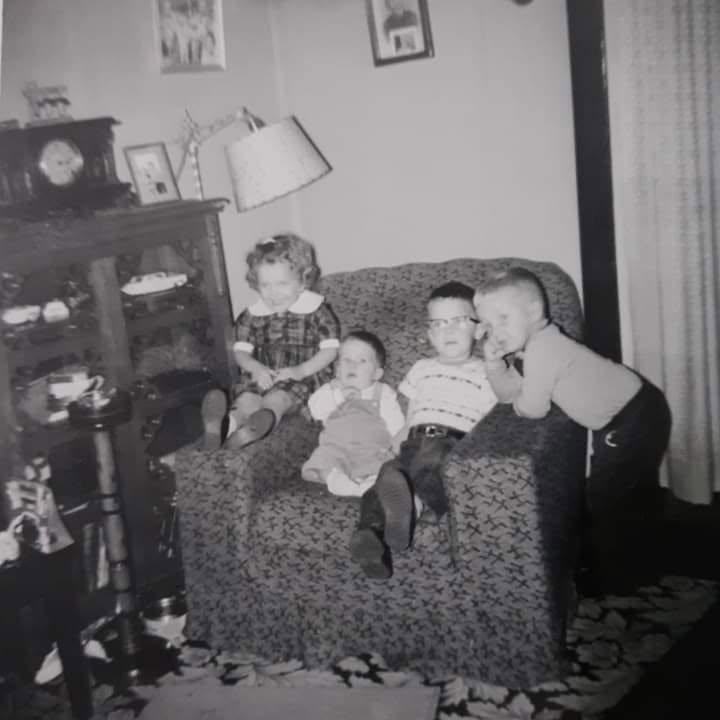 a black and white 1960's photo that shows the smoke stand to the right of the chair