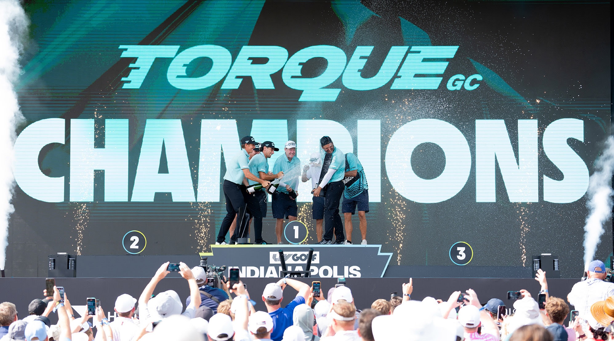 First place team champions Torque GC celebrate their team win as well as Sebastián Muñoz’s Individual win on the podium following the final round of LIV Golf Indianapolis 2025 at The Club at Chatham Hills in Westfield, Indiana. (Photo by LIV Golf)